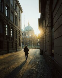 silhouette of a man walking in the alley toward the berlin cathedral berlin germany